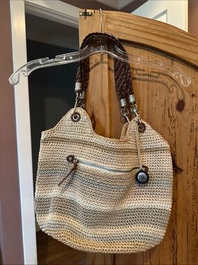 The Sak Beige Crochet Shoulder Bag with Brown Braided Handles